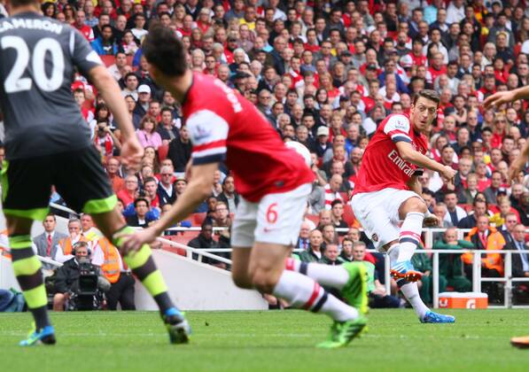 Arsenal v Stoke City . . London, UK . . 22.09.2013 Mesut Ozil (A) fires in the free-kick which led to the first Arsenal goal.