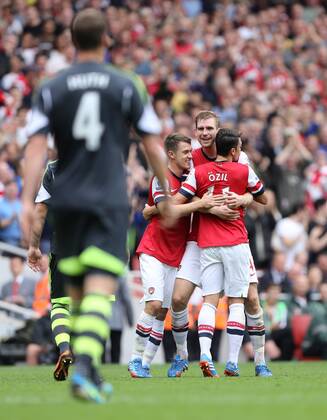 Arsenal s Per Mertesacker celebrates scoring his sides second goal Arsenal v Stoke - Barclays Premier League- Emirates Stadium - London - England -22 09 2013 - EDITORIAL USE ONLY. No use with unauthorised audio, video, data, fixture lists, club league logos or live services. Online in-match use limited to 120 images, no video emulation. No use in betting, games or single club league player publications.