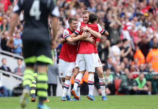 Arsenal s Per Mertesacker celebrates scoring his sides second goal Arsenal v Stoke - Barclays Premier League- Emirates Stadium - London - England -22 09 2013 - EDITORIAL USE ONLY. No use with unauthorised audio, video, data, fixture lists, club league logos or live services. Online in-match use limited to 120 images, no video emulation. No use in betting, games or single club league player publications.