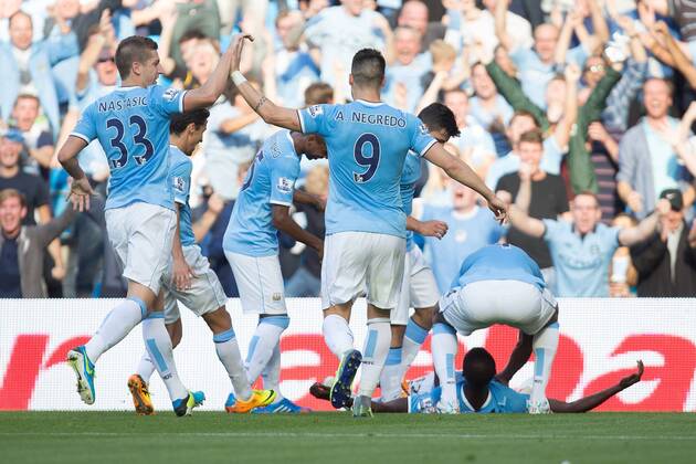 Yaya Toure of Manchester City celebrates scoring his sides second goal - Manchester City vs Manchester United - Barclay s Premier League - Etihad Stadium - Manchester - 22 09 2013 EDITORIAL USE ONLY. No use with unauthorised audio, video, data, fixture lists, club league logos or live services. Online in-match use limited to 120 images, no video emulation. No use in betting, games or single club league player publications.