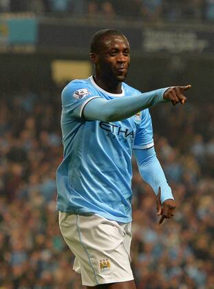 Yaya Toure of Manchester City celebrates scoring from a free kick for the third goal - Capital One Cup - Third Round - Manchester City vs Wigan Athletic - Etihad Stadium - Manchester - 24 09 13 - Picture Simon Bellis Sportimage EDITORIAL USE ONLY. No use with unauthorised audio, video, data, fixture lists, club league logos or live services. Online in-match use limited to 120 images, no video emulation. No use in betting, games or single club league player publications.