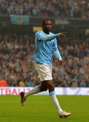 Yaya Toure of Manchester City celebrates scoring from a free kick for the third goal - Capital One Cup - Third Round - Manchester City vs Wigan Athletic - Etihad Stadium - Manchester - 24 09 13 - Picture Simon Bellis Sportimage EDITORIAL USE ONLY. No use with unauthorised audio, video, data, fixture lists, club league logos or live services. Online in-match use limited to 120 images, no video emulation. No use in betting, games or single club league player publications.