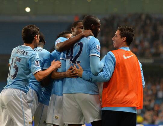 Yaya Toure of Manchester City celebrates his goal with sub Samir Nasri of Manchester City - Capital One Cup - Third Round - Manchester City vs Wigan Athletic - Etihad Stadium - Manchester - 24 09 13 - Picture Simon Bellis Sportimage EDITORIAL USE ONLY. No use with unauthorised audio, video, data, fixture lists, club league logos or live services. Online in-match use limited to 120 images, no video emulation. No use in betting, games or single club league player publications.