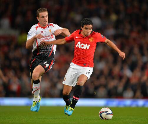 Jordan Henderson of Liverpool tussles with Rafael of Manchester United - Capital One Cup - Third Round - Manchester United, ManU - FC Liverpool. Old Trafford Stadium - Manchester - 25 09 13 - PicturexSimon BellisxSportimage EDITORIAL USE ONLY. No use with unauthorised audio, video, data, fixture lists, club league logos or live services. Online in-match use limited to 120 images, no video emulation. No use in betting, games or single club league player publications.