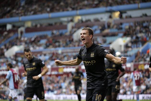 Edin Dzeko celebrates scoring to give Manchester City the lead at 2-1 - Football - Barclays Premier League - Aston Villa vs Manchester City - Villa Park Birmingham - Season 2013-2014 - September 28th 2013 - Photograph Malcolm Couzens Sportimage EDITORIAL USE ONLY. No use with unauthorised audio, video, data, fixture lists, club league logos or live services. Online in-match use limited to 120 images, no video emulation. No use in betting, games or single club league player publications.