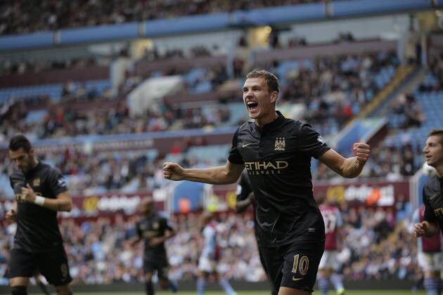 Edin Dzeko celebrates scoring to give Manchester City the lead at 2-1 - Football - Barclays Premier League - Aston Villa vs Manchester City - Villa Park Birmingham - Season 2013-2014 - September 28th 2013 - Photograph Malcolm Couzens Sportimage EDITORIAL USE ONLY. No use with unauthorised audio, video, data, fixture lists, club league logos or live services. Online in-match use limited to 120 images, no video emulation. No use in betting, games or single club league player publications.
