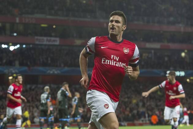 01.10.2013 London, England. Arsenal forward Olivier Giroud (12) celebrates his goal during the UEFA Champions League Group Stage fixture between Arsenal and SSC Napoli from the Emirates Stadium xDavidxFearnx  ActionPlus20148814