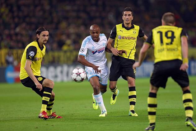 01.10.2013, xovx, Fussball Champions League, Borussia Dortmund (BVB) - Olympique Marseille, v.l. Neven Subotic (Borussia Dortmund), Andre Ayew (Olympique Marseille), Nuri Sahin (Borussia Dortmund), Kevin Grosskreutz (Borussia Dortmund). Aktion.