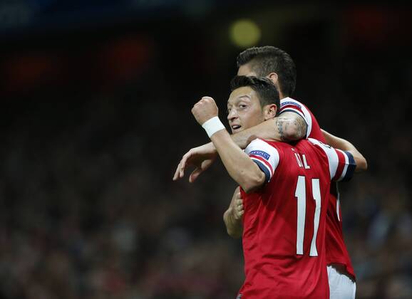 Arsenal s Mesut Ozil celebrates his sides second goal Arsenal FC Lodnon v SSC Napoli - Champions League - Emirates Stadium - London - England -01 10 2013 - EDITORIAL USE ONLY. No use with unauthorised audio, video, data, fixture lists, club league logos or live services. Online in-match use limited to 120 images, no video emulation. No use in betting, games or single club league player publications.