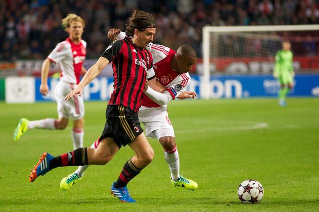 (L-R) Riccardo Montolivo of AC Milan, Lerin Duarte of Ajax during the Champions League match between Ajax Amsterdam and AC Milan on Oktober 1, 2013 at the Amsterdam Arena in Amsterdam, The Netherlands. Ajax v AC Milan Champions League 2013 2014 xVIxxIVx 1825945