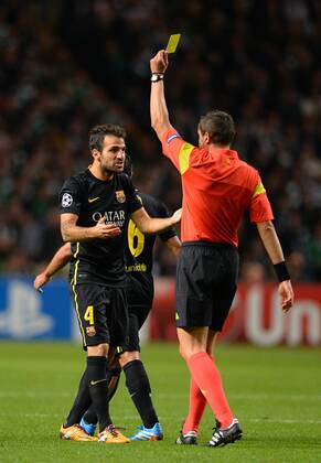 Cesc Fabregas of Barcelona gets a yellow card - UEFA Champions League Group H - Celtic vs Barcelona - Celtic Park Stadium - Glasgow - Scotland - 01 10 13 - Picture Simon Bellis Sportimage EDITORIAL USE ONLY. No use with unauthorised audio, video, data, fixture lists, club league logos or live services. Online in-match use limited to 120 images, no video emulation. No use in betting, games or single club league player publications.