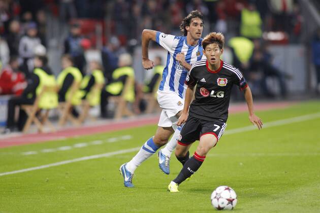 Carlos Martinez 2 (Real Sociedad de Futbol San Sebastian) and Heung-Min Son 7 (Bayer 04 Leverkusen) (left to right). Aktion, Action --- Bayer Leverkusen 04 - Real Sociedad de Futbol San Sebastian, Fussball, UEFA Champions League, 02.10.2013 --- During UEFA Champions League group A match between Bayer 04 Leverkusen and Real Sociedad de Futbol San Sebastian at the BayArena in Leverkusen, Germany EP_jge