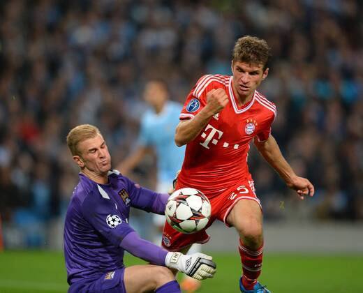 Thomas Muller of Bayern Munich rounds Joe Hart of Manchester City to score the second goal - UEFA Champions League Group D - Manchester City vs Bayern Munich - Etihad Stadium - Manchester - England - 02 10 13 - Picture Simon Bellis Sportimage EDITORIAL USE ONLY. No use with unauthorised audio, video, data, fixture lists, club league logos or live services. Online in-match use limited to 120 images, no video emulation. No use in betting, games or single club league player publications.