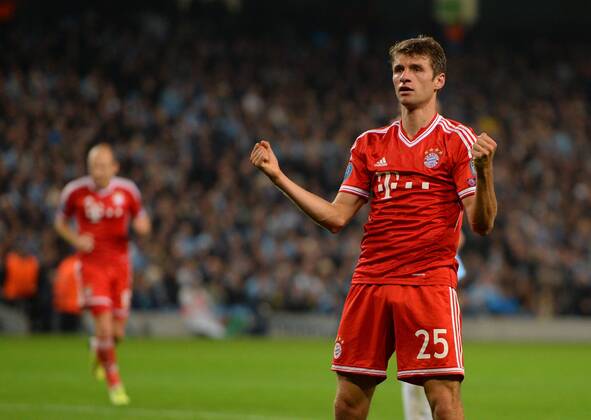 Thomas Muller of Bayern Munich celebrates scoring the second goal - UEFA Champions League Group D - Manchester City vs Bayern Munich - Etihad Stadium - Manchester - England - 02 10 13 - Picture Simon Bellis Sportimage EDITORIAL USE ONLY. No use with unauthorised audio, video, data, fixture lists, club league logos or live services. Online in-match use limited to 120 images, no video emulation. No use in betting, games or single club league player publications.