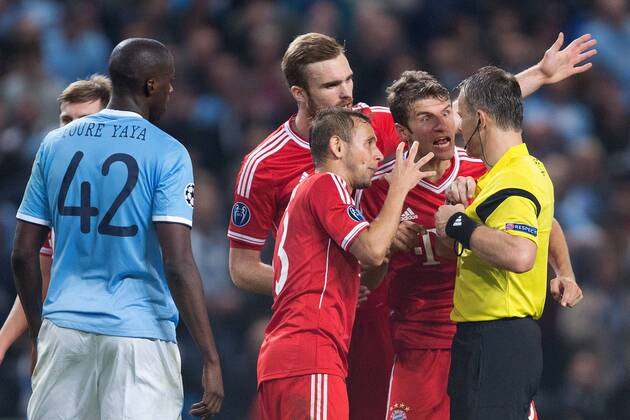 Thomas Muller of Munich shows his anger towards referee Bjorn Kuipers as Jerome Boateng is sent off - Manchester City vs. FC Bayern Munich - UEFA Champion s League - Etihad Stadium - Manchester - 02 19 2013 Pic Philip Oldham Sportimage EDITORIAL USE ONLY. No use with unauthorised audio, video, data, fixture lists, club league logos or live services. Online in-match use limited to 120 images, no video emulation. No use in betting, games or single club league player publications.