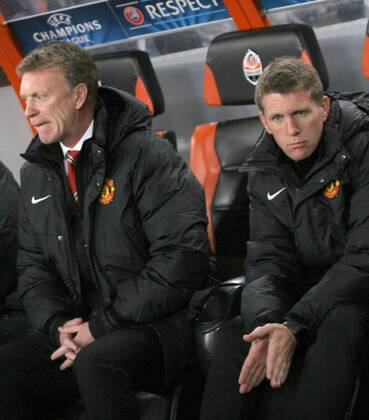 ITAR-TASS: DONETSK, UKRAINE. OCTOBER 2, 2013. Manchester United manager David Moyes (L) at the UEFA Champions League 2013 2014 Group A Round 2, Shakhtar Donetsk vs Manchester United match. The game ended in a 1-1 draw.  RE12B25C