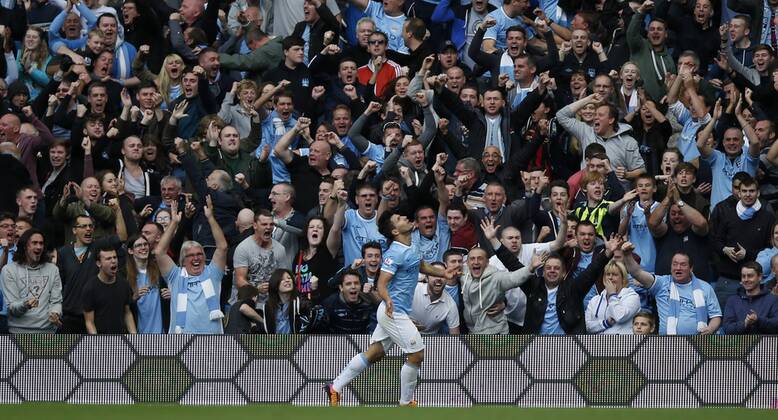 MANCHESTER, Sergio Aguero of Manchester City celebrates scoring during the Barclays Premier League match between Manchester City and Everton at Etihad Stadium in Manchester, Britain on Oct. 5, 2013.(Xinhua Wang Lili) FOR EDITORIAL USE ONLY. NOT FOR SALE FOR MARKETING OR ADVERTISING CAMPAIGNS. NO USE WITH UNAUTHORIZED AUDIO, VIDEO, DATA, FIXTURE LISTS, CLUB LEAGUE LOGOS OR LIVE SERVICES. ONLINE IN-MATCH USE LIMITED TO 45 IMAGES, NO VIDEO EMULATION. NO USE IN BETTING, GAMES OR SINGLE CLUB LEAGUE PLAYER PUBLICATIONS. (SP)BRITAIN-MANCHESTER-SOCCER-PREMIER LEAGUE-MAN CITY VS EVERTON 