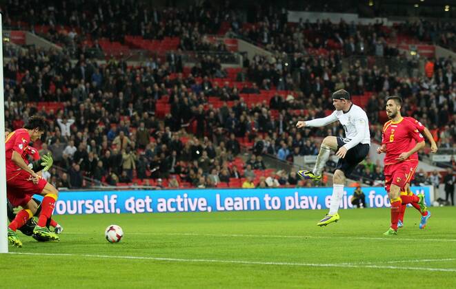 England s Wayne Rooney scoring his sides opening goal England v Montenegro - World Cup Qualifier - London - Wembley - England -11 10 2013 - Pic David Klein Sportimage EDITORIAL USE ONLY. No use with unauthorised audio, video, data, fixture lists, club league logos or live services. Online in-match use limited to 120 images, no video emulation. No use in betting, games or single club league player publications.