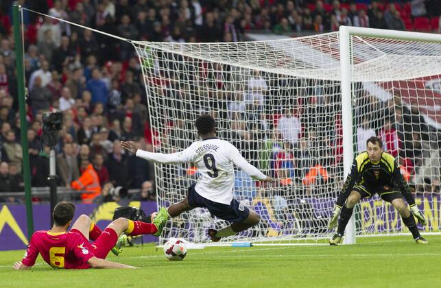 11.10.2013 London, England. Montenegro s Ivan KECOJEVIC brings down England s Daniel STURRIDGE after a heavy challenge, ultimately leading to a penalty, during the World Cup Qualifier between England and Montenegro from Wembley Stadium. xCraigxMercerx  ActionPlus11460230