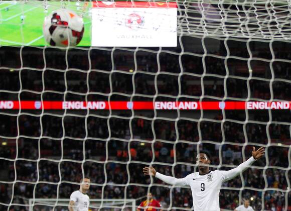Daniel Sturridge of England celebrates scoring during the FIFA 2014 World Cup Qualifying match between England and Montenegro at Wembley Stadium in London, Britain on Oct. 11, 2013. England won 4-1.(Xinhua Yin Gang) (SP)BRITAIN-LONDON-SOCCER-FIFA 2014 WORLD CUP QUALIFIER-ENGLAND VS MONTENEGRO