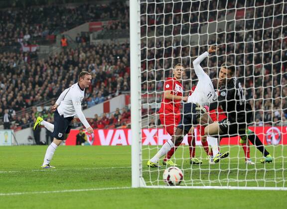 England s Wayne Rooney scoring his sides opening goal England v Poland - 2014 World Cup Qualifier - Wembley - London - England -15 10 2013 - Pic David Klein Sportimage EDITORIAL USE ONLY. No use with unauthorised audio, video, data, fixture lists, club league logos or live services. Online in-match use limited to 120 images, no video emulation. No use in betting, games or single club league player publications.