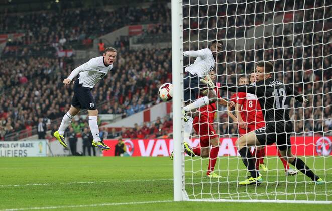 England s Wayne Rooney scoring his sides opening goal England v Poland - 2014 World Cup Qualifier - Wembley - London - England -15 10 2013 - Pic David Klein Sportimage EDITORIAL USE ONLY. No use with unauthorised audio, video, data, fixture lists, club league logos or live services. Online in-match use limited to 120 images, no video emulation. No use in betting, games or single club league player publications.