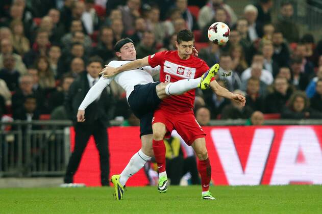 England s Wayne Rooney and Poland s Robert Lewandowski - England v Poland - 2014 Fifa World Cup Qualifier - London - Wembley - England - 15 10 2013 - Pic Charlie Forgham-Bailey Sportimage EDITORIAL USE ONLY. No use with unauthorised audio, video, data, fixture lists, club league logos or live services. Online in-match use limited to 120 images, no video emulation. No use in betting, games or single club league player publications.