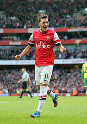 Arsenal s Mesut Ozil celebrates scoring his sides second goal Arsenal FC London v Norwich City - Barclays Premier League - Emirates Stadium - London - England -19 10 2013 - EDITORIAL USE ONLY. No use with unauthorised audio, video, data, fixture lists, club league logos or live services. Online in-match use limited to 120 images, no video emulation. No use in betting, games or single club league player publications.