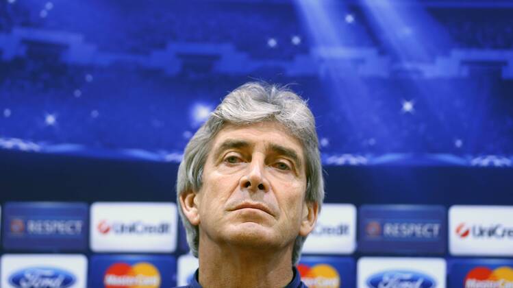 ITAR-TASS: MOSCOW, RUSSIA. OCTOBER 22, 2013. Man. City s manager Manuel Pellegrini looks on during a news conference ahead of the first leg of their UEFA Champions League Group S football match against CSKA Moscow.  RE12D832