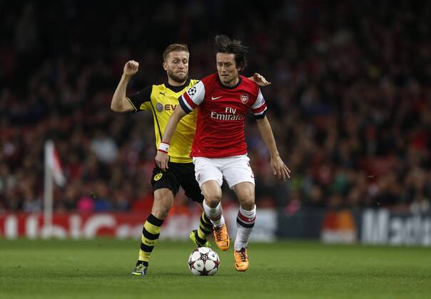 Arsenal s Tomas Rosicky tussles with Dortmund s Jakub Kuba Blaszczykowski Arsenal v Dortmund - UEFA Champions League - the Emirates - London - England -22 10 2013 - Pic David Klein Sportimage EDITORIAL USE ONLY. No use with unauthorised audio, video, data, fixture lists, club league logos or live services. Online in-match use limited to 120 images, no video emulation. No use in betting, games or single club league player publications.