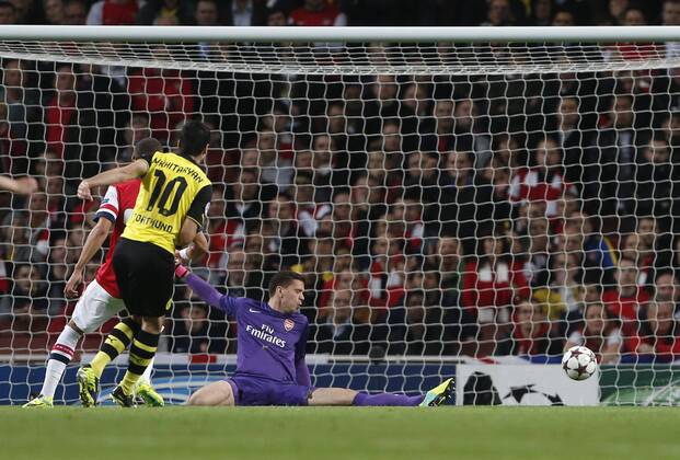 Dortmund s Henrikh Mkhitaryan scoring his sides opening goal Arsenal v Dortmund - UEFA Champions League - the Emirates - London - England -22 10 2013 - Pic David Klein Sportimage EDITORIAL USE ONLY. No use with unauthorised audio, video, data, fixture lists, club league logos or live services. Online in-match use limited to 120 images, no video emulation. No use in betting, games or single club league player publications.