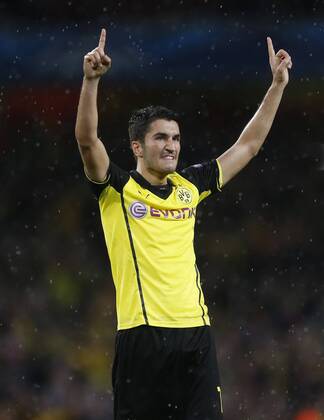 Dortmund s Nuri Sahin celebrates at the final whistle Arsenal v Dortmund - UEFA Champions League - the Emirates - London - England -22 10 2013 - Pic David Klein Sportimage EDITORIAL USE ONLY. No use with unauthorised audio, video, data, fixture lists, club league logos or live services. Online in-match use limited to 120 images, no video emulation. No use in betting, games or single club league player publications.