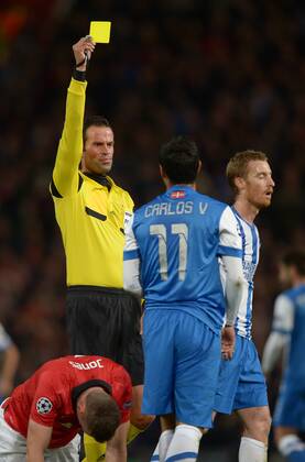 Carlos Vela of Real Sociedad shown a yellow card by referee Bas Nijhuis - UEFA Champions League Group A - Manchester Utd vs Real Sociedad - Old Trafford Stadium - Manchester - England - 23 10 13 - EDITORIAL USE ONLY. No use with unauthorised audio, video, data, fixture lists, club league logos or live services. Online in-match use limited to 120 images, no video emulation. No use in betting, games or single club league player publications.