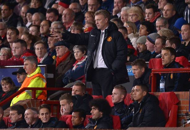 David Moyes manager of Manchester United stands up in the dugout to direct the team - UEFA Champions League Group A - Manchester Utd - Old Trafford Stadium - Manchester - England - 23 10 13 - EDITORIAL USE ONLY. No use with unauthorised audio, video, data, fixture lists, club league logos or live services. Online in-match use limited to 120 images, no video emulation. No use in betting, games or single club league player publications.
