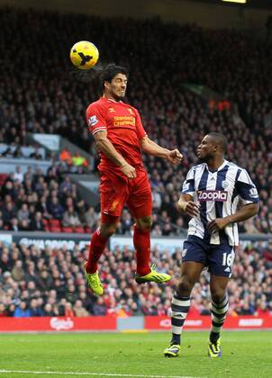 Liverpool s Luis Suarez celebrates scoring his third goal - Liverpool FC v West Bromwich Albion - Barclays Premier League - Anfield - Liverpool - England -26 10 2013 - EDITORIAL USE ONLY. No use with unauthorised audio, video, data, fixture lists, club league logos or live services. Online in-match use limited to 120 images, no video emulation. No use in betting, games or single club league player publications.