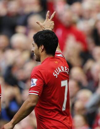 Liverpool s Luis Suarez celebrates scoring his third goal - Liverpool FC v West Bromwich Albion - Barclays Premier League - Anfield - Liverpool - England -26 10 2013 - EDITORIAL USE ONLY. No use with unauthorised audio, video, data, fixture lists, club league logos or live services. Online in-match use limited to 120 images, no video emulation. No use in betting, games or single club league player publications.
