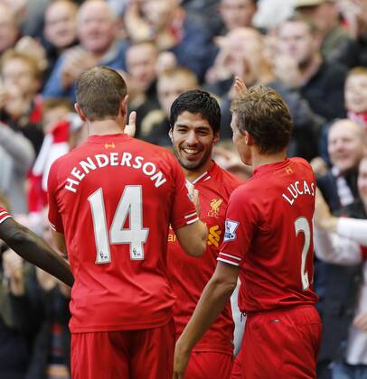 Liverpool s Luis Suarez celebrates scoring his third goal - Liverpool FC v West Bromwich Albion - Barclays Premier League - Anfield - Liverpool - England -26 10 2013 - EDITORIAL USE ONLY. No use with unauthorised audio, video, data, fixture lists, club league logos or live services. Online in-match use limited to 120 images, no video emulation. No use in betting, games or single club league player publications.