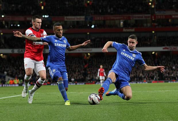 Arsenal s Carl Jenkinson tussles with Chelsea s Ryan Bertrand and Chelsea s Gary Cahill Arsenal v Chelsea - Capital One Cup Fourth Round - The Emirates - London - England -29 10 2013 - Pic David Klein Sportimage EDITORIAL USE ONLY. No use with unauthorised audio, video, data, fixture lists, club league logos or live services. Online in-match use limited to 120 images, no video emulation. No use in betting, games or single club league player publications.