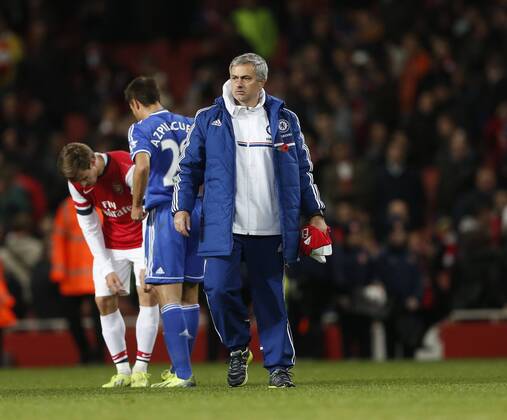 Chelsea manager Jose Mourinho walks off with Arsenal s Mesut Ozil s shirt Arsenal v Chelsea - Capital One Cup Fourth Round - The Emirates - London - England -29 10 2013 - Pic David Klein Sportimage EDITORIAL USE ONLY. No use with unauthorised audio, video, data, fixture lists, club league logos or live services. Online in-match use limited to 120 images, no video emulation. No use in betting, games or single club league player publications.