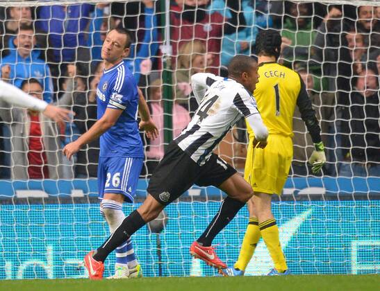 Loic Remy of Newcastle United celebrates the second goal as John Terry of Chelsea looks dejected - Barclays Premier League - Newcastle Utd vs Chelsea - St James Park Stadium - Newcastle - England - 02 11 13 - Picture Simon Bellis Sportimage EDITORIAL USE ONLY. No use with unauthorised audio, video, data, fixture lists, club league logos or live services. Online in-match use limited to 120 images, no video emulation. No use in betting, games or single club league player publications.