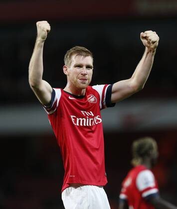 Arsenal s Per Mertesacker celebrates at the final whistle Arsenal v Liverpool - Barclays Premier League - Emirates Stadium - London - England -02 11 2013 - Pic David Klein Sportimage EDITORIAL USE ONLY. No use with unauthorised audio, video, data, fixture lists, club league logos or live services. Online in-match use limited to 120 images, no video emulation. No use in betting, games or single club league player publications.