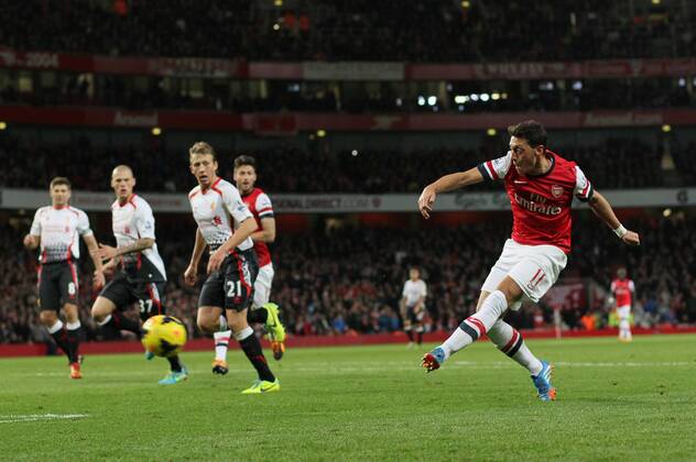 Arsenal s Mesut Ozil fires in a shot Arsenal v Liverpool - Barclays Premier League - Emirates Stadium - London - England -02 11 2013 - Pic David Klein Sportimage EDITORIAL USE ONLY. No use with unauthorised audio, video, data, fixture lists, club league logos or live services. Online in-match use limited to 120 images, no video emulation. No use in betting, games or single club league player publications.