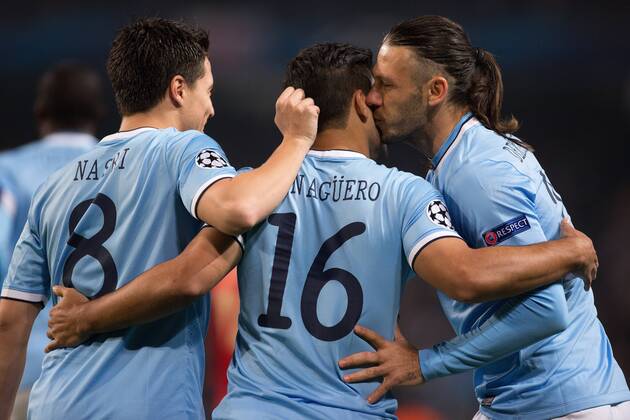Martin Demichelis kisses Sergio - Kun - Aguero of Manchester City following his opening goal - Manchester City vs. CSKA Moscow - UEFA Champions League - Etihad Stadium - Manchester - 05 11 2013 EDITORIAL USE ONLY. No use with unauthorised audio, video, data, fixture lists, club league logos or live services. Online in-match use limited to 120 images, no video emulation. No use in betting, games or single club league player publications.