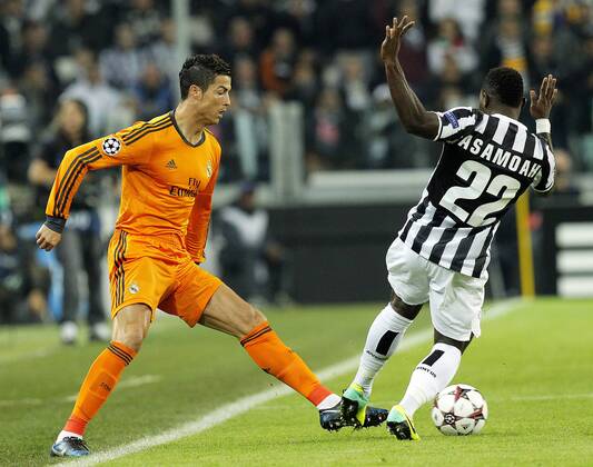 Kwadwo Asamoah (R) Juventus, Cristiano Ronaldo Real Madrid, Torino 05-11-2013 Juventus Stadium Football Calcio 2013 2014 Champions League Juventus Turin - Real Madrid MarcoxBertorello