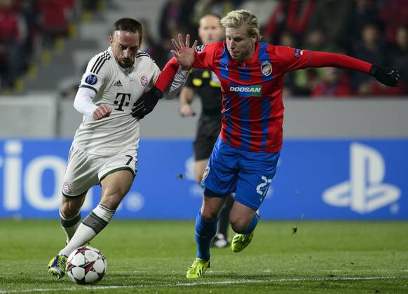 Franck Ribery (Bayern, left) and Frantisek Rajtoral (Plzen) are pictured during their 4th round of the Champions League group D soccer match FC Viktoria Plzen vs. FC Bayern Munich in Pilsen, Czech Republic, November 5, 2013. (CTKxPhoto MichalxKamaryt) CTKPhotoP201311050858601  kmt 3