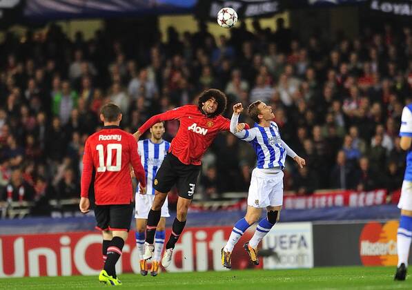 Nov. 5, 2013 - San Sebastian, Pais Basco, Spain - Manchester U. defender PATRICE EVRA, (L) heads the ball with Real Sociedad midfielder DAVID ZURUTUZA, (right) during the match between Real Sociedad San Sebastian vs Manchester United at Anoeta Stadium. Soccer - 2013 - UEFA Champions League, Real Sociedad San Sebastian vs Manchester United (ManU).  - ZUMAm11