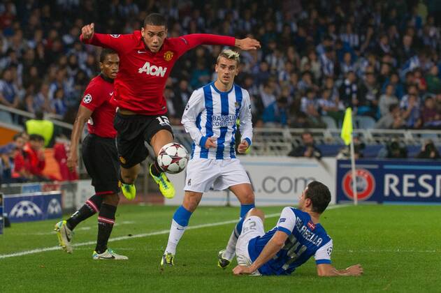 San Sebastian, Spain, 2013 11 05 Chris Smalling (12)(Manchester U) and De la Bella (24)(Real Sociedad) during the UEFA Champions League match between Real Sociedad San Sebastian and Manchester United (ManU) at Anoeta Stadium 