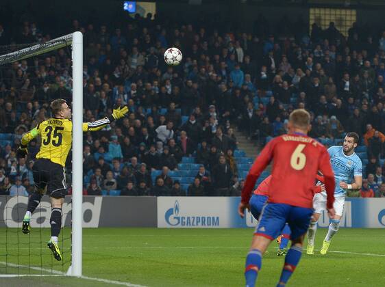 Alvaro Negredo of Manchester City scores his hatrick goal past Igor Akinfeev of CSKA Moscow - UEFA Champions League Group D - Manchester City vs CSKA Moscow - Etihad Stadium - Manchester - England - 05 11 13 - EDITORIAL USE ONLY. No use with unauthorised audio, video, data, fixture lists, club league logos or live services. Online in-match use limited to 120 images, no video emulation. No use in betting, games or single club league player publications.