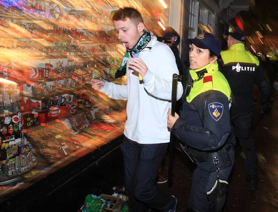 Police tries to control clashes with Celtic s supporters at Dam square downtown Amsterdam on 6 November, 2013. Celtic from Ireland, they play against Ajax Amsterdam for the Champions League football match in Arena tonight. (  xbyxPauloxAmorim)