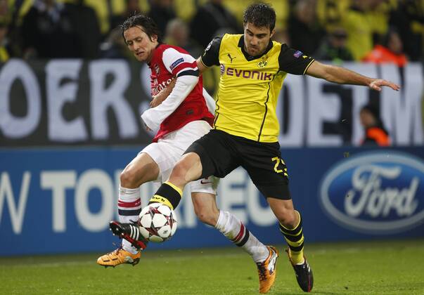 Dortmund s Sokratis Papastathopoulos tussles with Arsenal s Tomas Rosicky Dortmund v Arsenal - Champions League -Westfalenstadion - Dortmund - Germany - 06 11 2013 - Pic David Klein Sportimage EDITORIAL USE ONLY. No use with unauthorised audio, video, data, fixture lists, club league logos or live services. Online in-match use limited to 120 images, no video emulation. No use in betting, games or single club league player publications.